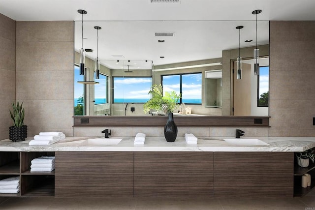 6627 Muirlands Dr, La Jolla, CA 92037 - full bath featuring double vanity, healthy amount of natural light, and a shower
