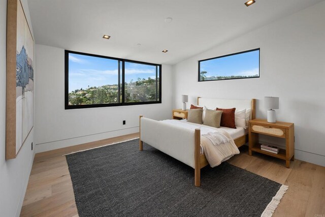 6627 Muirlands Dr, La Jolla, CA 92037 - bedroom featuring light wood-style floors, multiple windows, lofted ceiling, and recessed lighting