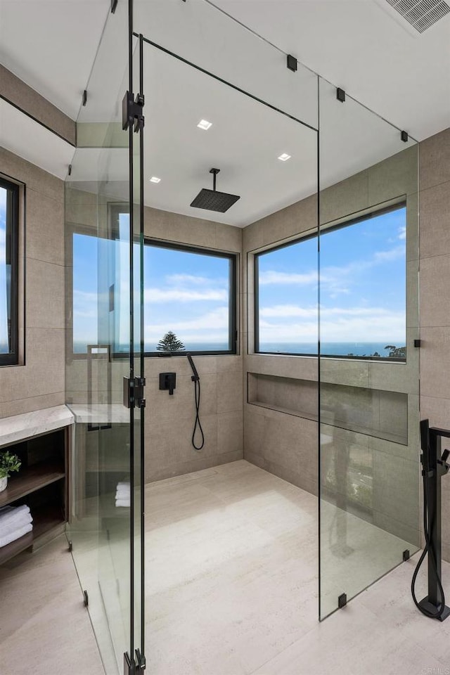 6627 Muirlands Dr, La Jolla, CA 92037 - full bathroom with a stall shower and tile walls
