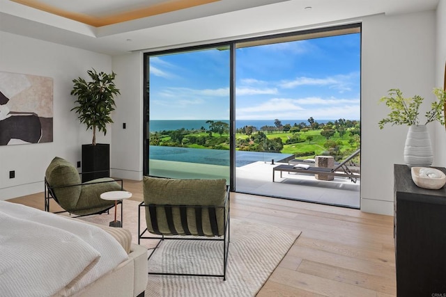6627 Muirlands Dr, La Jolla, CA 92037 - bedroom featuring expansive windows, access to outside, multiple windows, and wood finished floors