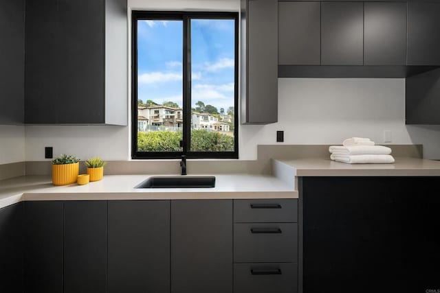 6627 Muirlands Dr, La Jolla, CA 92037 - kitchen with modern cabinets, light countertops, and healthy amount of natural light