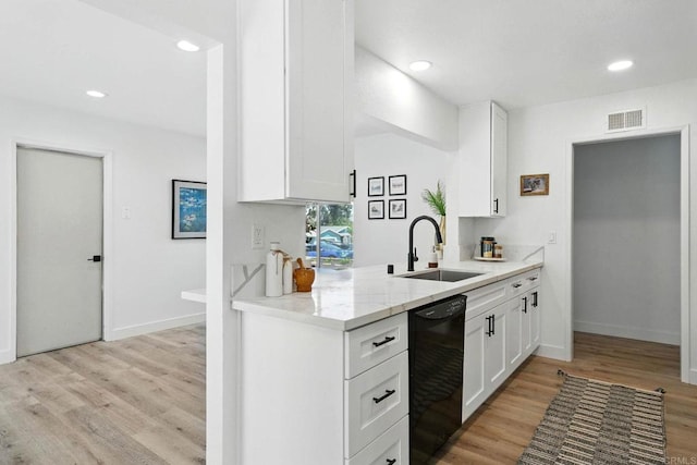 1472 Loma Ln, Chula Vista, CA 91911 - kitchen featuring black dishwasher, light wood-type flooring, white cabinetry, recessed lighting, and light stone counters