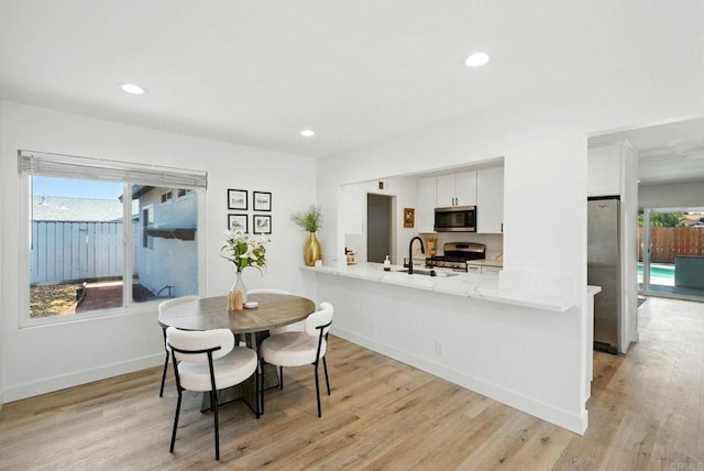 1472 Loma Ln, Chula Vista, CA 91911 - dining room with light wood finished floors and recessed lighting