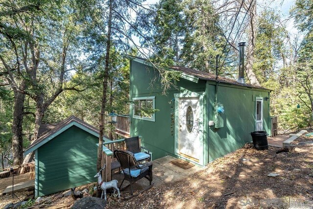 22230 Crestline Rd, Palomar Mountain, CA 92060 - view of property exterior with stucco siding