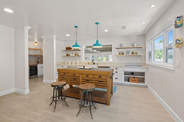 18 Gateview Dr, Fallbrook, CA 92028 - kitchen featuring open shelves, beverage cooler, light countertops, white cabinets, and recessed lighting