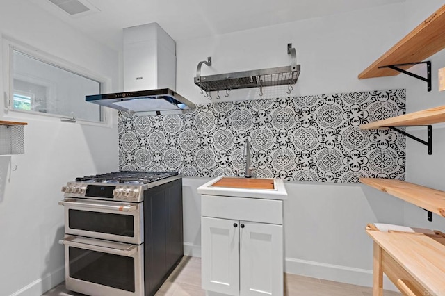 18 Gateview Dr, Fallbrook, CA 92028 - kitchen featuring range with two ovens, extractor fan, open shelves, white cabinetry, and backsplash