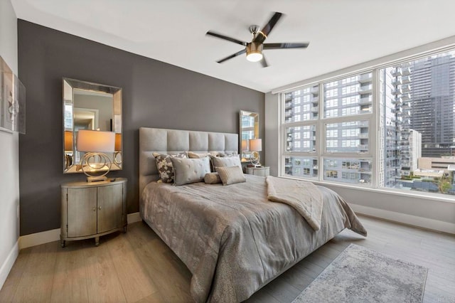 1325 Pacific Hwy Unit 1004, San Diego, CA 92101 - bedroom featuring wood finished floors and ceiling fan