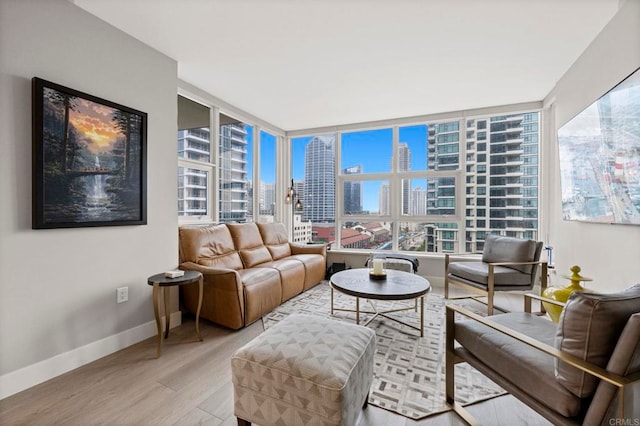 1325 Pacific Hwy Unit 1004, San Diego, CA 92101 - living room featuring a city view, wood finished floors, and plenty of natural light