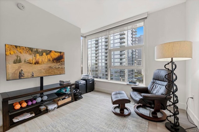 1325 Pacific Hwy Unit 1004, San Diego, CA 92101 - sitting room with a city view, wood finished floors, and plenty of natural light