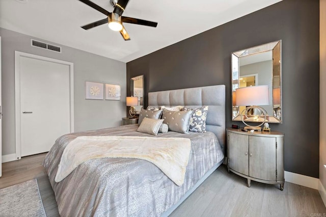1325 Pacific Hwy Unit 1004, San Diego, CA 92101 - bedroom featuring wood finished floors and ceiling fan