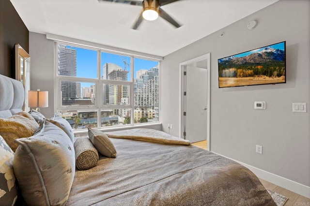 1325 Pacific Hwy Unit 1004, San Diego, CA 92101 - bedroom with light wood-style flooring and a ceiling fan