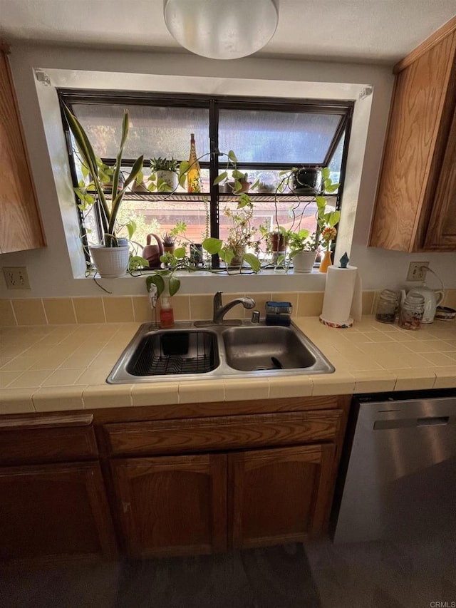 8606 Valley View Trl, Pine Valley, CA 91962 - kitchen featuring stainless steel dishwasher, tile counters, and brown cabinets