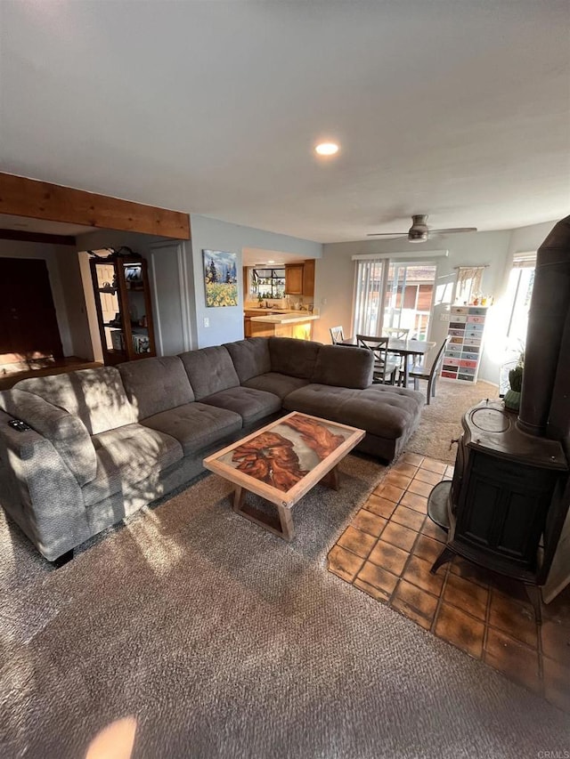 8606 Valley View Trl, Pine Valley, CA 91962 - carpeted living area featuring a wood stove, ceiling fan, tile patterned flooring, and recessed lighting