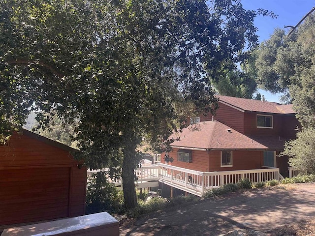 8606 Valley View Trl, Pine Valley, CA 91962 - view of home's exterior with a wooden deck and roof with shingles