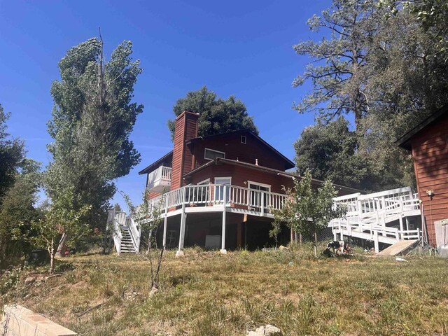 8606 Valley View Trl, Pine Valley, CA 91962 - rear view of house featuring a wooden deck, a chimney, and stairway