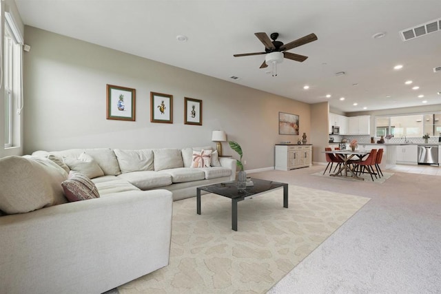 3520 Conner Way, Oceanside, CA 92056 - living area with ceiling fan, light carpet, and recessed lighting