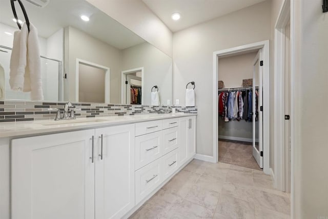 3520 Conner Way, Oceanside, CA 92056 - full bathroom featuring a walk in closet, tasteful backsplash, double vanity, a stall shower, and recessed lighting