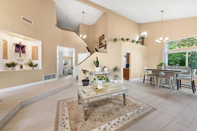 653 Diamond Dr, Chula Vista, CA 91911 - living room featuring a chandelier, a high ceiling, and wood finished floors