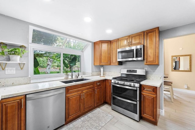 653 Diamond Dr, Chula Vista, CA 91911 - kitchen featuring stainless steel appliances, brown cabinets, recessed lighting, and light wood finished floors
