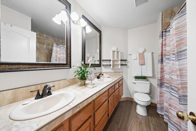 653 Diamond Dr, Chula Vista, CA 91911 - bathroom with double vanity, wood finished floors, and a shower with curtain