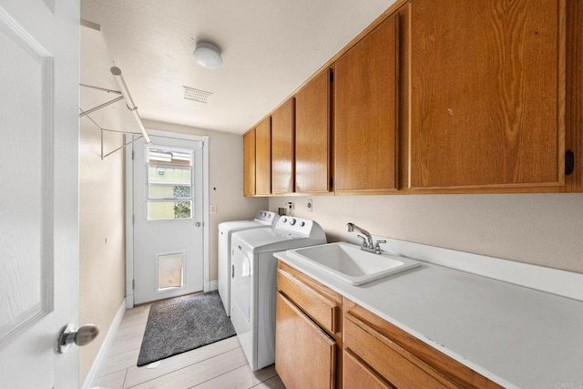 653 Diamond Dr, Chula Vista, CA 91911 - laundry room with washer and clothes dryer and cabinet space