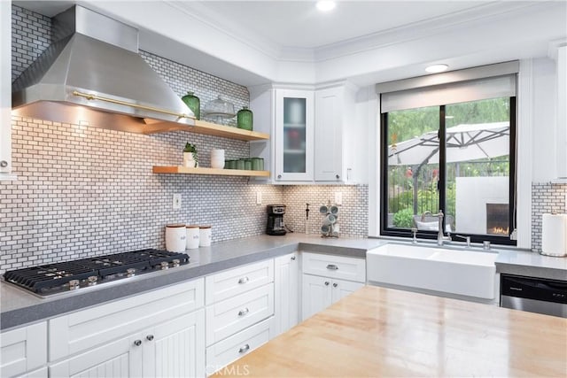 23 Fawnridge Pl, Aliso Viejo, CA 92656 - kitchen with wall chimney range hood, appliances with stainless steel finishes, ornamental molding, decorative backsplash, and white cabinetry