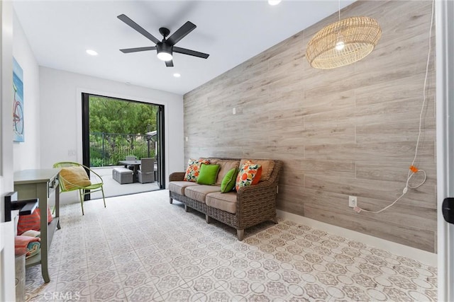 23 Fawnridge Pl, Aliso Viejo, CA 92656 - living area featuring an accent wall, recessed lighting, ceiling fan, and wood walls