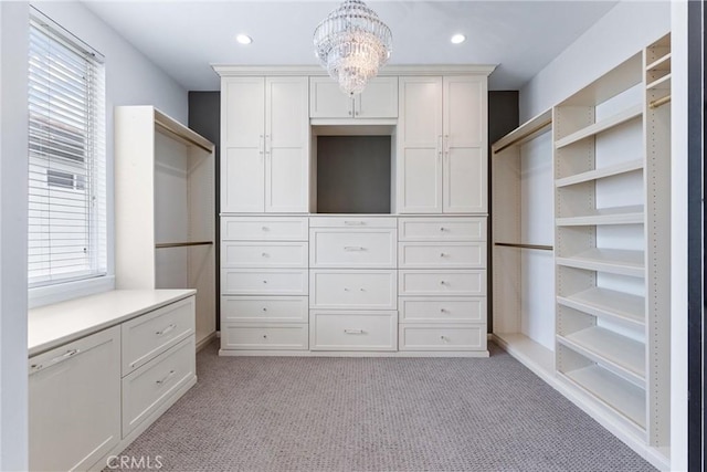 23 Fawnridge Pl, Aliso Viejo, CA 92656 - walk in closet with light carpet and a chandelier