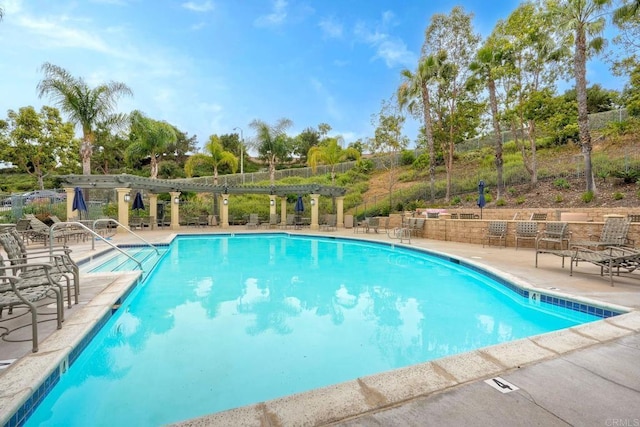 4049 Peninsula Dr, Carlsbad, CA 92010 - community pool featuring a patio and view of wooded area
