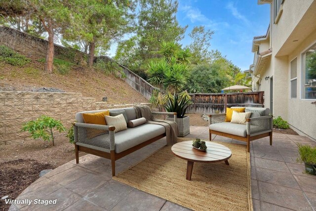 4049 Peninsula Dr, Carlsbad, CA 92010 - fenced backyard with outdoor lounge area and a patio area