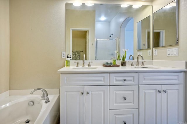 4049 Peninsula Dr, Carlsbad, CA 92010 - bathroom featuring double vanity, a garden tub, and an enclosed shower