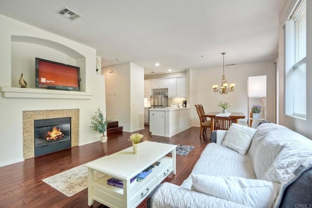 4049 Peninsula Dr, Carlsbad, CA 92010 - living area featuring a chandelier, dark wood-style flooring, recessed lighting, and a tiled fireplace