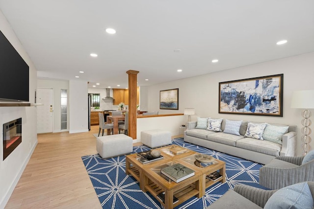 2610 Torrey Pines Rd Unit C21, La Jolla, CA 92037 - living area with light wood-style flooring, recessed lighting, and a glass covered fireplace