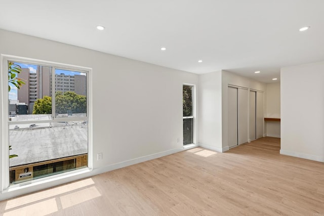 2610 Torrey Pines Rd Unit C21, La Jolla, CA 92037 - unfurnished room with healthy amount of natural light, light wood-type flooring, and recessed lighting