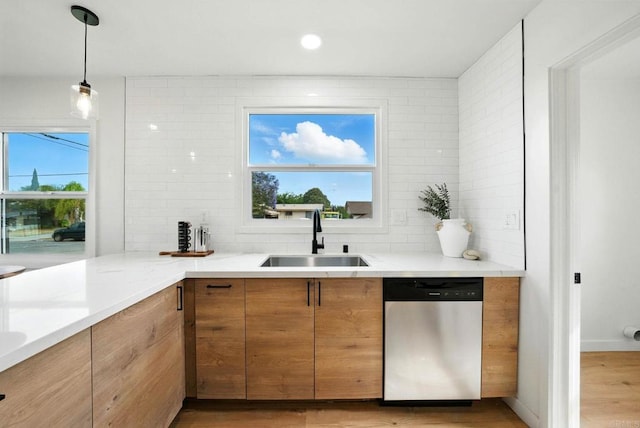 640 Pyramid St, San Diego, CA 92114 - kitchen with stainless steel dishwasher, light wood finished floors, tasteful backsplash, and plenty of natural light