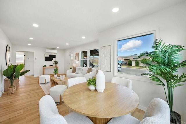 640 Pyramid St, San Diego, CA 92114 - dining area with a wall unit AC, recessed lighting, plenty of natural light, and light wood finished floors