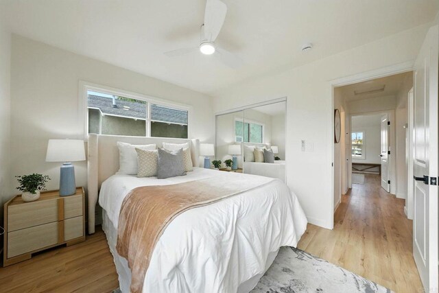 640 Pyramid St, San Diego, CA 92114 - bedroom with multiple windows, light wood-style flooring, a closet, and ceiling fan