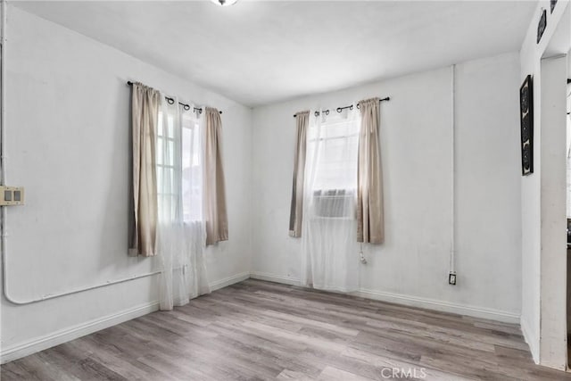 671 N Cherry St, Banning, CA 92220 - spare room with wood finished floors and baseboards