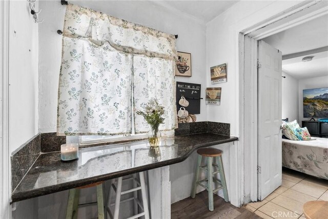 671 N Cherry St, Banning, CA 92220 - kitchen with dark countertops and tile patterned floors