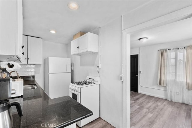 671 N Cherry St, Banning, CA 92220 - kitchen featuring white appliances, white cabinets, light wood-style floors, recessed lighting, and tasteful backsplash