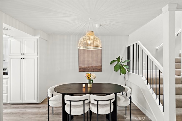 917 Hyde Ct, Costa Mesa, CA 92626 - dining space with light wood finished floors and stairway