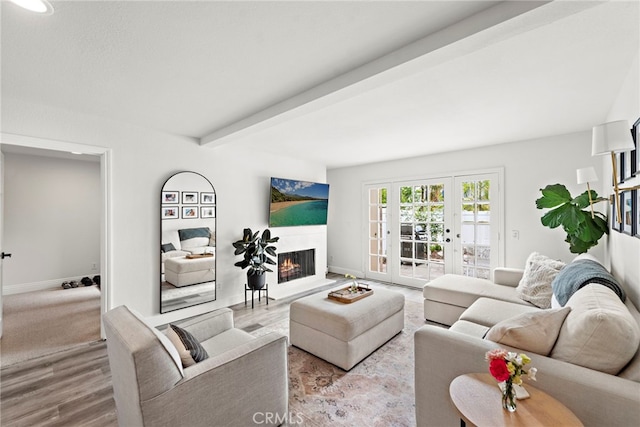 917 Hyde Ct, Costa Mesa, CA 92626 - living area with wood finished floors, a lit fireplace, beamed ceiling, and french doors