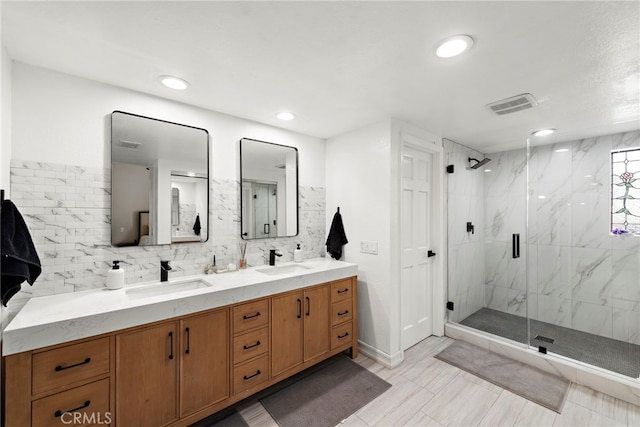 917 Hyde Ct, Costa Mesa, CA 92626 - full bathroom featuring a marble finish shower, double vanity, recessed lighting, and tasteful backsplash