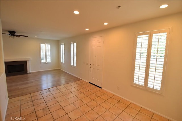 2 Lynde St, Ladera Ranch, CA 92694 - unfurnished living room with recessed lighting, a fireplace, ceiling fan, and light tile patterned floors