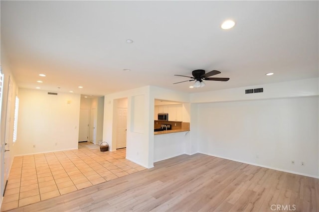 2 Lynde St, Ladera Ranch, CA 92694 - unfurnished living room with recessed lighting, light wood-style flooring, and ceiling fan