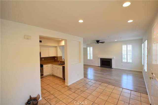 2 Lynde St, Ladera Ranch, CA 92694 - unfurnished living room featuring a fireplace, light tile patterned floors, recessed lighting, and a ceiling fan