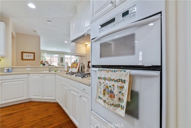 2747 Traditions Loop, Paso Robles, CA 93446 - kitchen with white appliances, white cabinets, wood finished floors, light countertops, and recessed lighting