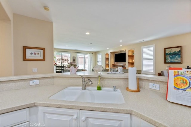 2747 Traditions Loop, Paso Robles, CA 93446 - kitchen featuring open floor plan, white cabinets, light countertops, and recessed lighting