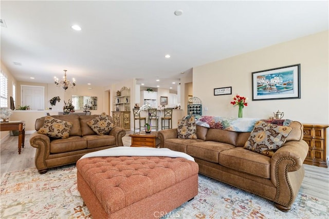 2747 Traditions Loop, Paso Robles, CA 93446 - living room featuring a chandelier, light wood-style flooring, and recessed lighting