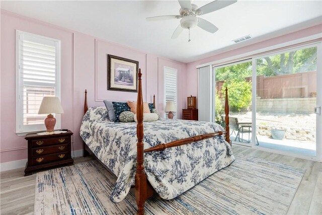 2747 Traditions Loop, Paso Robles, CA 93446 - bedroom with access to outside, light wood finished floors, and ceiling fan